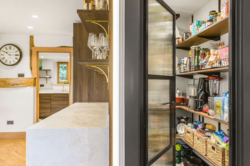 Walk-in pantry and kitchen cabinetry in the Barn Conversion