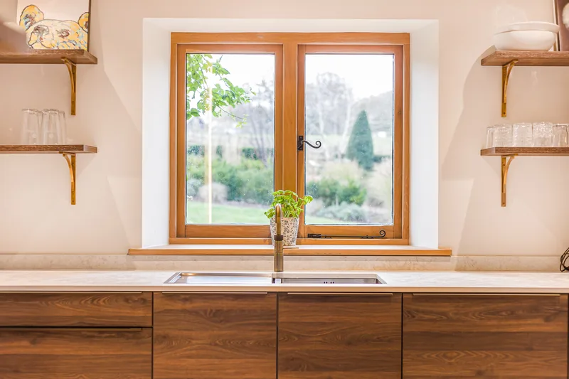 Sink run and walnut cabinetry in the Barn Conversion